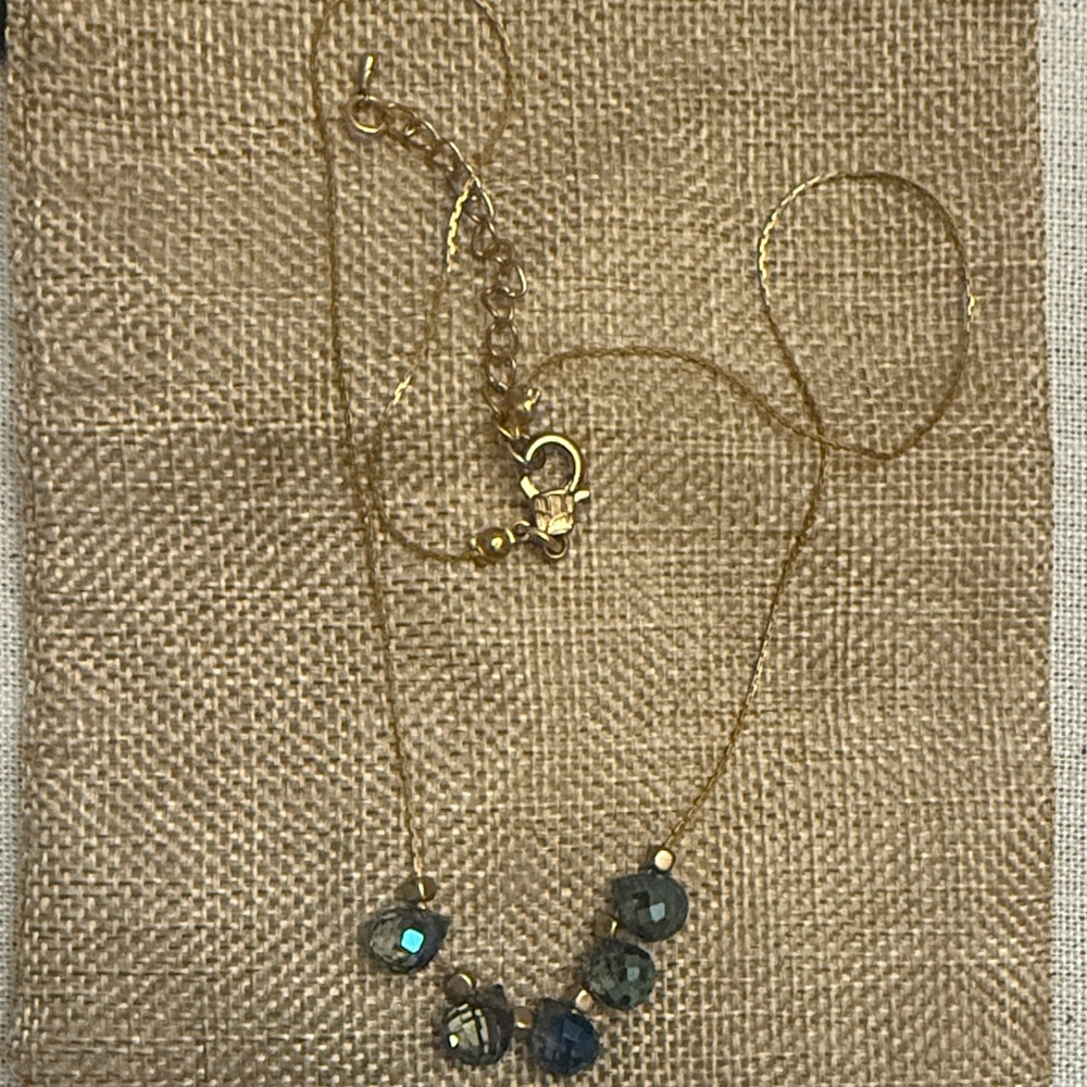 Elegant Gold necklace with blue glass stones